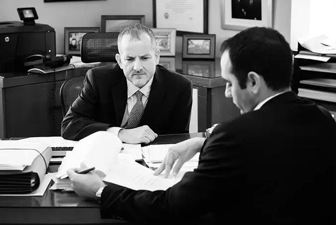 Two people reviewing documents