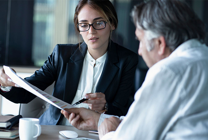 Lawyer discussing document to a client